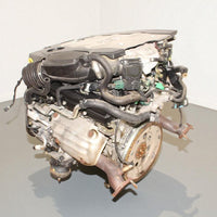 V6 engine on a gray surface with a white background