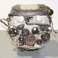 V6 engine on a gray surface with a white background
