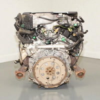 V6 engine on a gray surface with a white background