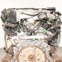 V6 engine on a gray surface with a white background
