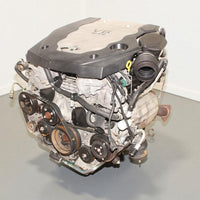 V6 engine on a gray surface with a white background